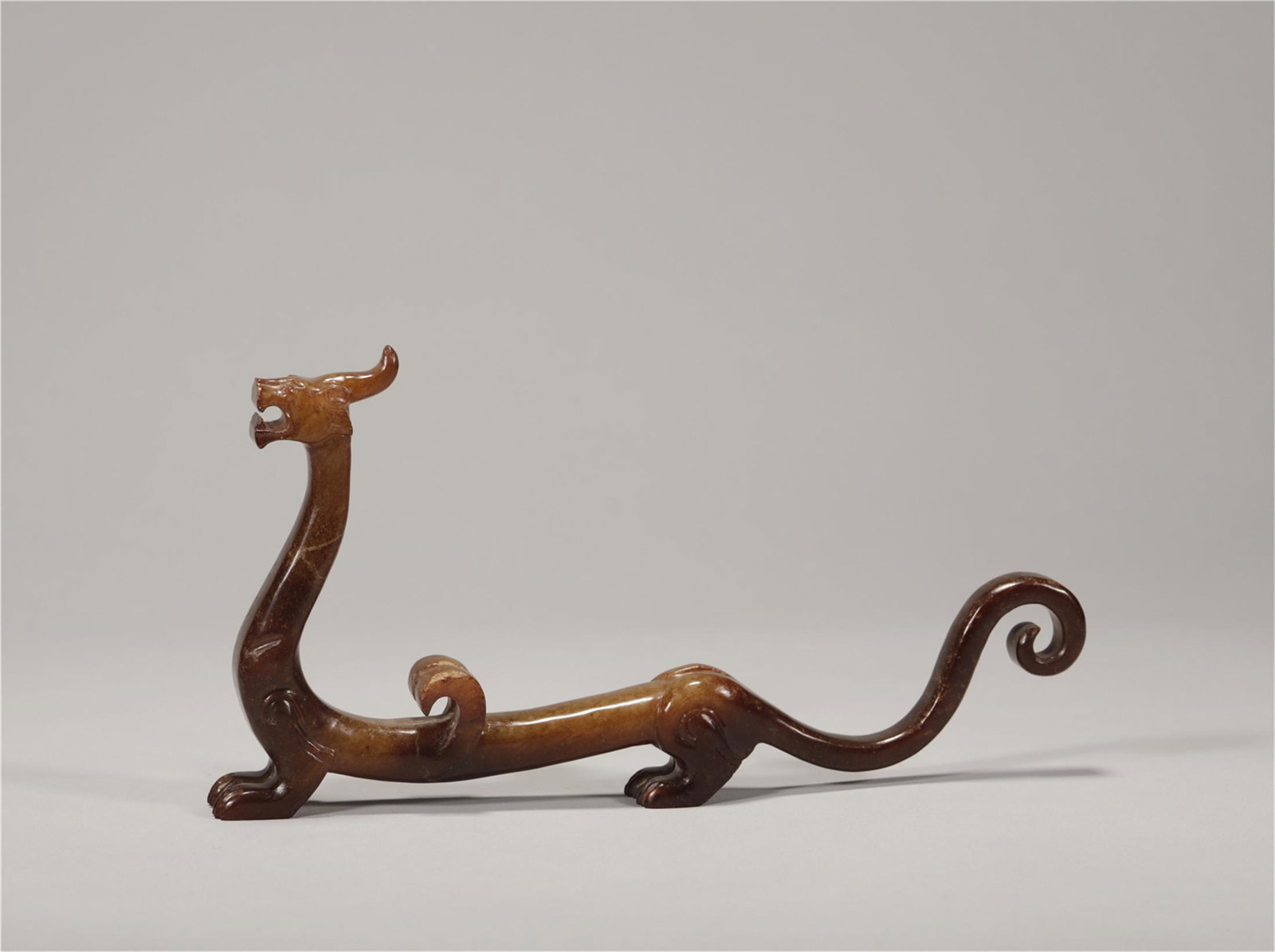 A JADE DRAGON CARVING FIGURINE (1 of 6)