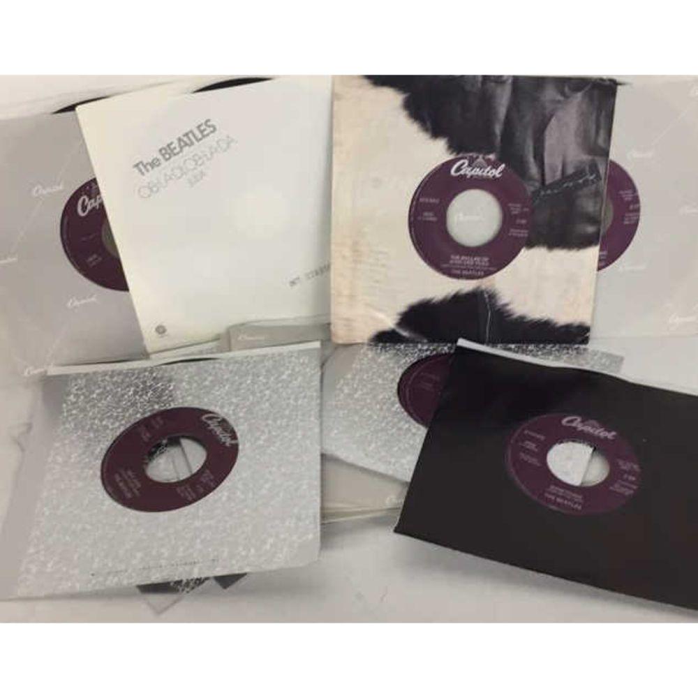 New/Old Dealer Stock - (14 Different) 1988 Beatles: Capitol Records Purple Label Re-Issue 45 RPM Records w/Orig Sleeves - 2056 Hell Goodbye, 2138 Lady Madonna, 2276 Hey Jude, 2490 Get Back, 2531 Ballad of John & Yoko, 2654 Something, 2764 Let It Be, 28