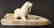 Eskimo carved walrus on artifact base by L. Kingeekuk