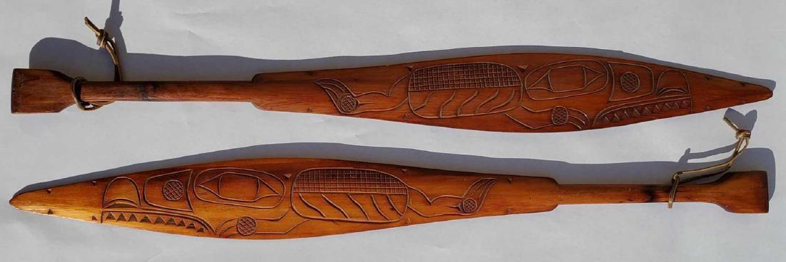Early 20th century Tlingit carved yellow spruce paddles (1 of 8)