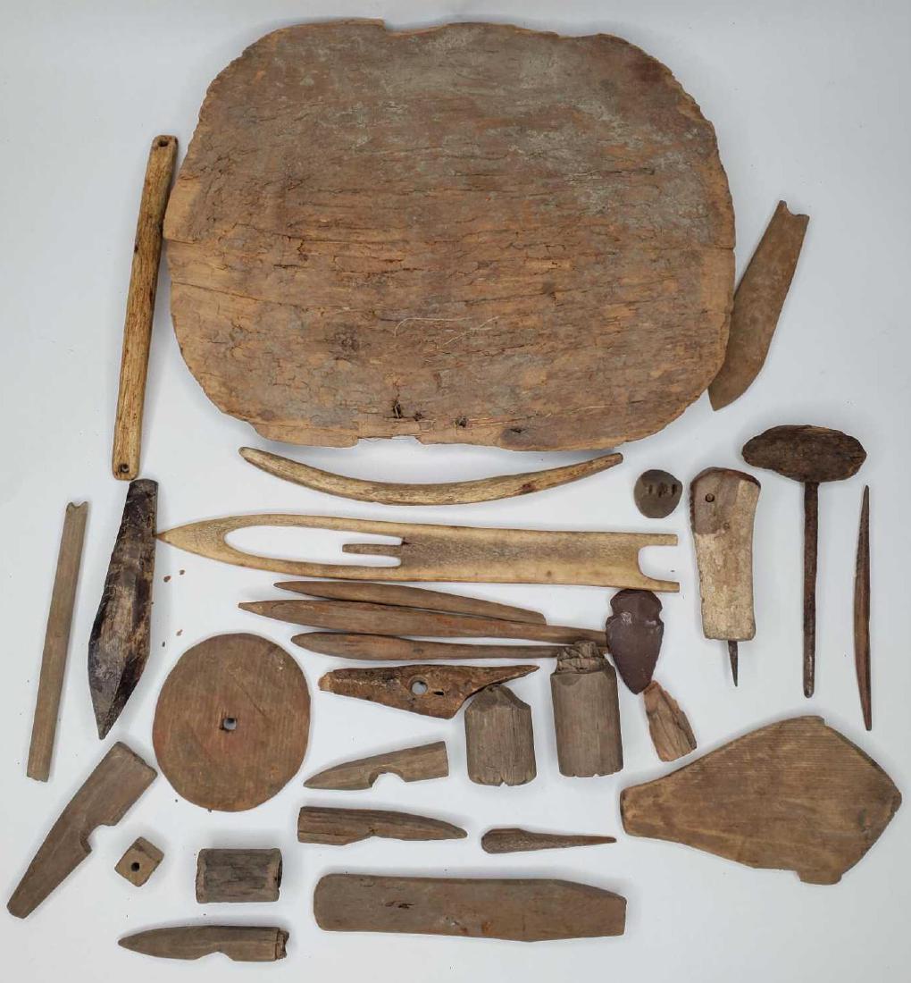 Large collection of Eskimo artifacts: 24 pieces total. To include several bird blunts, a net weight, net mender, harpoon point, several tooling devices, an arrowhead, basket handles, basket lid and more. Materials include bone, ivory, woo