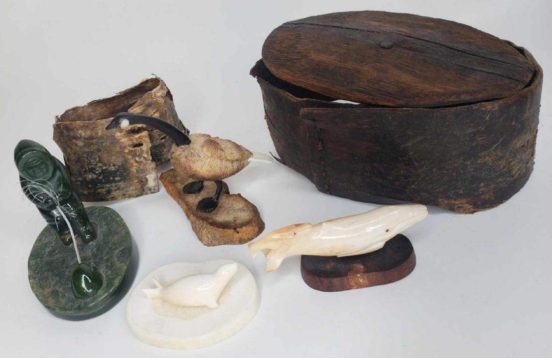 Eskimo carvings, jade carvings, baleen basket artifact: A very nice lot including an excellent colorized scrimshaw walrus ivory Canadian goose signed "Aninoayou (sp?)", a nice kobuk jade carving of an ice fisherman, a fossilized walrus ivory carving of mot