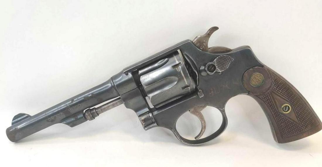 Smith & Wesson 1903 32 long, Spanish Copy: Lot is a Smith and Wesson model 1903 chambered in 32 long. It has the correct wood grips it's double/single action. Barrel is 4.25 inches the left side of the revolver is engraved BUTCH. Serial number