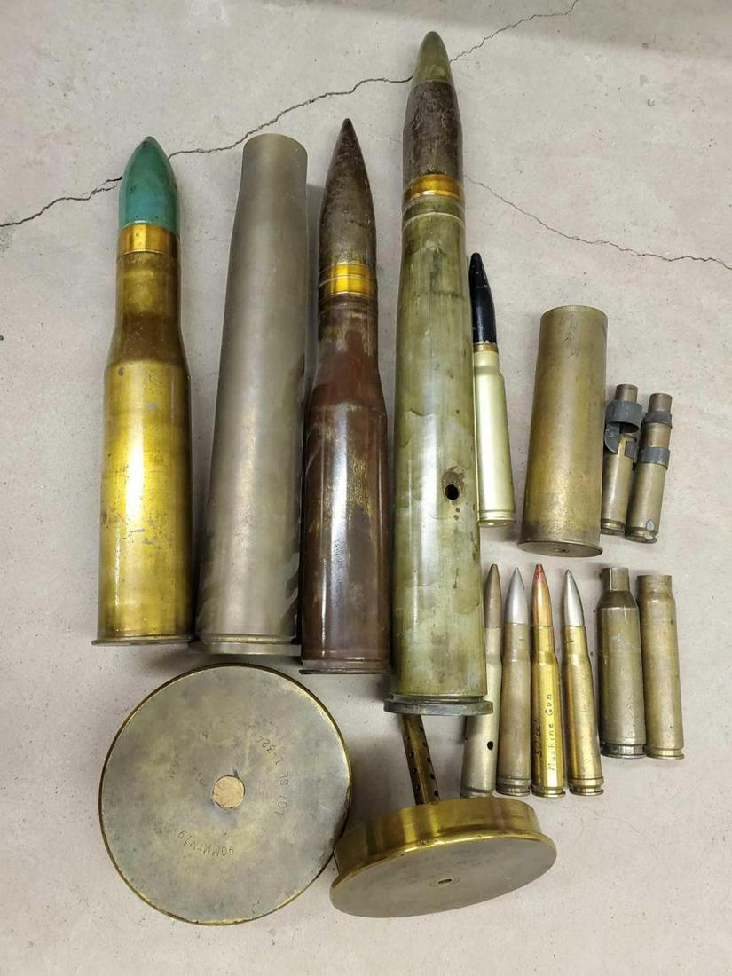 Artillery shells, large caliber ammo: This lot includes a variety of artillery shells all empty from 20mm up to 90mm The largest 17.5" long. There is a few empty 50 BMG rounds.