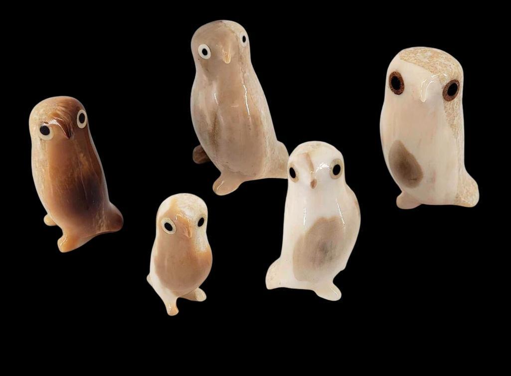 5x Eskimo Walrus Tusk Owl Carvings by Donald Ungott & Others: Five owls carved from fossilized walrus tusk with baleen eyes, three signed by Gambell carver Donald Ungott and two unsigned. The largest carving measures approximately 1.25" x 1.25" x 2" 