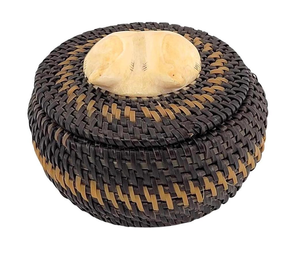 Mid-Century Baleen Basket w/Dual Seal Finial - att. Hank Family: A mid-20th-century Eskimo baleen basket with double seal walrus tusk lid. The piece is unsigned, but the double seal lid is a signature style of the highly regarded Hank family, more specifically, thi