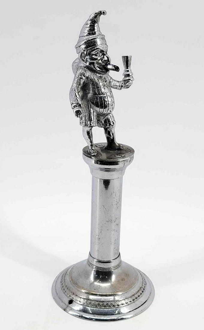Victorian Punch Tobacconist Counter Chrome Cigar Lighter: A scarce chrome metal store counter lighter with punch figure circa the late 19th or early 20th centuy. Measures approximately 4.5" in diameter at the base and 12" tall.