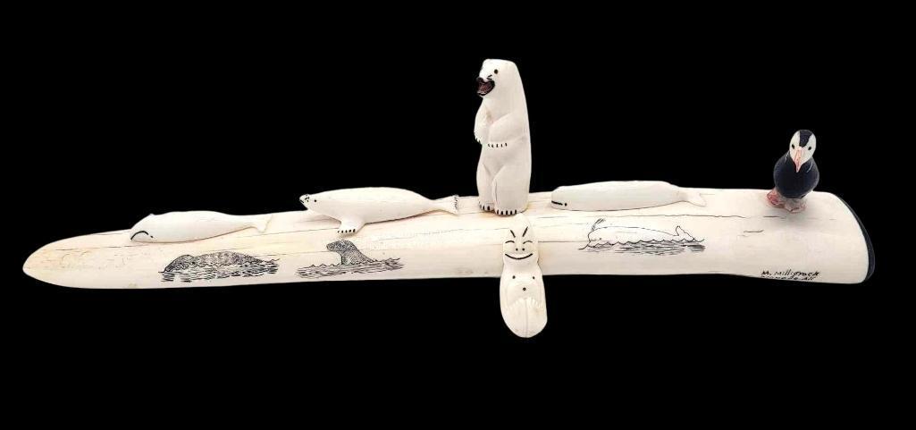 Elaborate Walrus Tusk Carved & Scrimshaw Display - Milligrock Family: An impressive display featuring a walrus tusk scrimmed with whales and seals bearing five individually carved and applied figures to include two whales, a seal, a puffin, a standing polar bear, and su