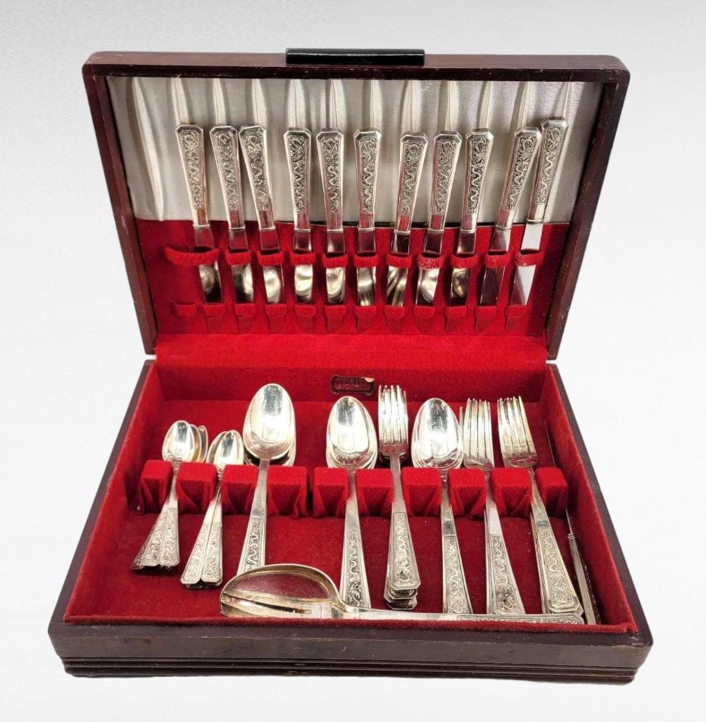 Russian .875 Silver Flatware Service w/Dragon Motifs: An extremely unusual and rare set of Russian .875 silver flatware with dragon motifs, possibly intended for export, early 20th century. The set is comprised of twelve four-place settings, each with a 