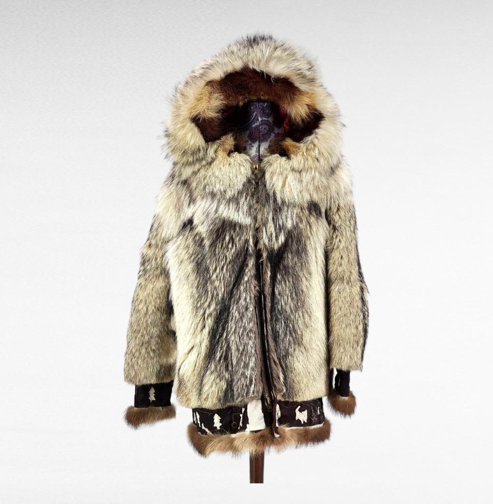 Vintage Eskimo Wolf & Wolverine Parka w/ Mittens: A mid 20th century heavy duty Eskimo wolf parka with matching animal head gloves, the hood lined with wolverine fur, the bottom trim of both the parka and gloves embroidered in caribou fur with scenes