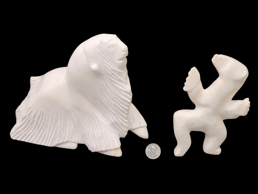 Inuit Marble Muskox & Polar Bear Sculptures: Two handcarved marble sculptures includes a muskox with left foot aloft, by Inuit artist Qiatsuk Shaa (Cape Dorset, Nunavut), and a polar bear standing upon hind legs, one of which has been fractured