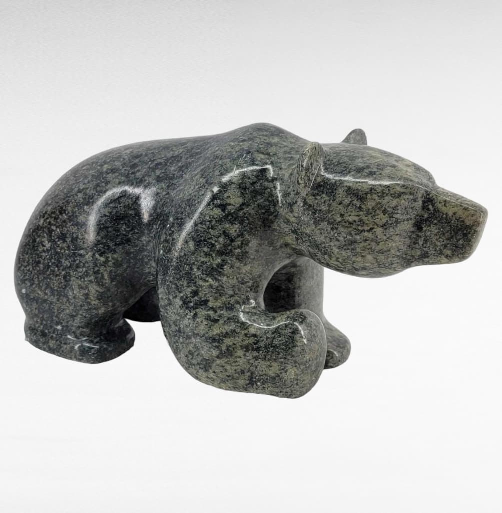 14" Soapstone Polar Bear Sculpture by Michael Scott: An impressive large carved soapstone sculpture depicting an advancing polar bear with right front paw aloft. Signed "M. Scott" upon the belly for the Alaskan artist Michael Scott and dated 200