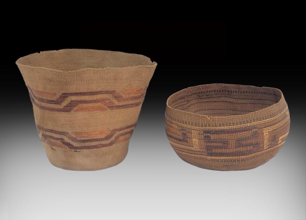Tlingit Spruce Root Berry & Utility Baskets: Two late 19th or early 20th century Tlingit spruce root baskets with bold falsely embroidered dyed bear grass geometric designs. The taller has two close proximity perforations on the side, a few smal