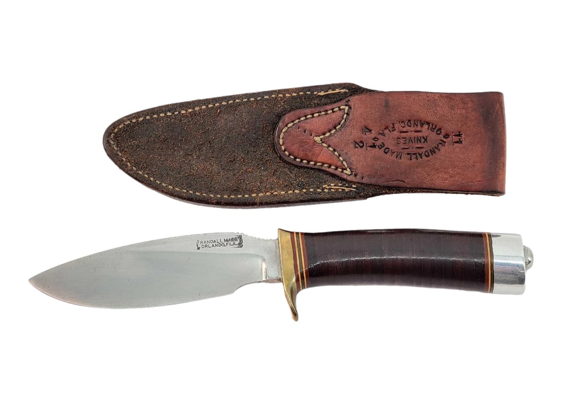 Randall Model 111 Alaskan Skinner Knife w/Sheath: An Alaskan Skinner (model 11) knife designed by Alaskan Guide Tommy Thompson in 1952 for Randall Made Knives; marked on left side of blade as shown. The drop-point blade is designed to prevent cutting