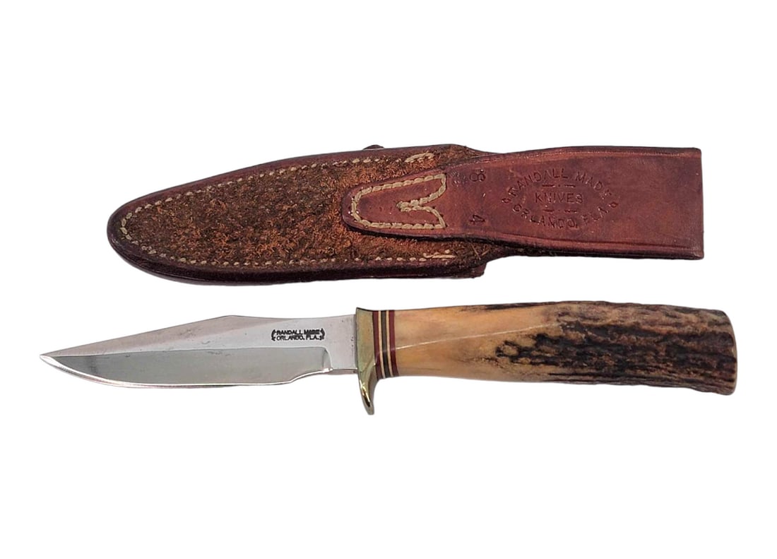 Randall Model 8 Trout & Bird Knife w/Sheath: A Model 8 Trout and Bird Knife marked for Randall Made Knives on one side of the blade and the other is etched "John S. Huyler Jr.". The drop point blade has a sharpened top edge, hidden tag, 