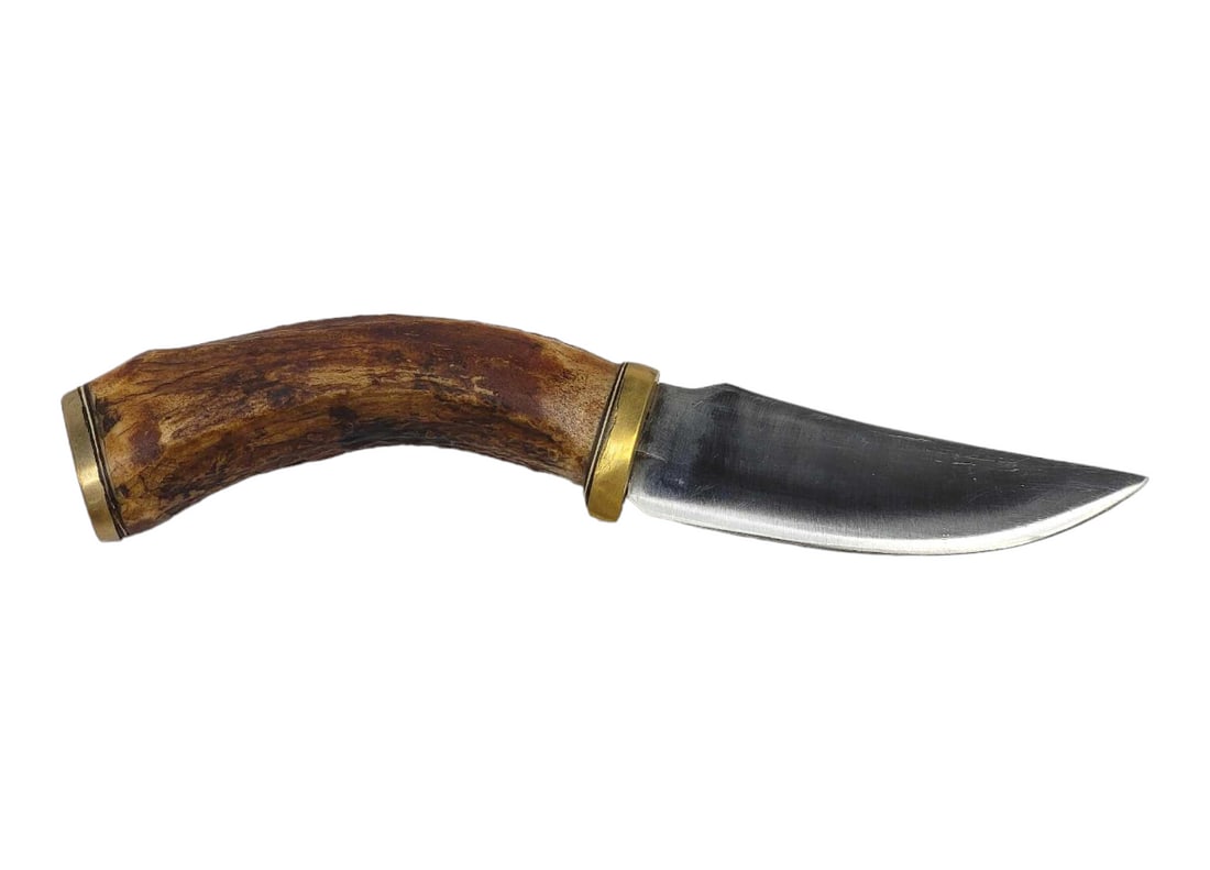 Kenneth Aaberge Hunting Knife: A fixed straight back blade hunting knife marked 9-10-99 Ken Aaberge for the late Montana knifemaker, on the blade, leading to a brass bolster, spacer and curved sag handle that ends with a brass pomm