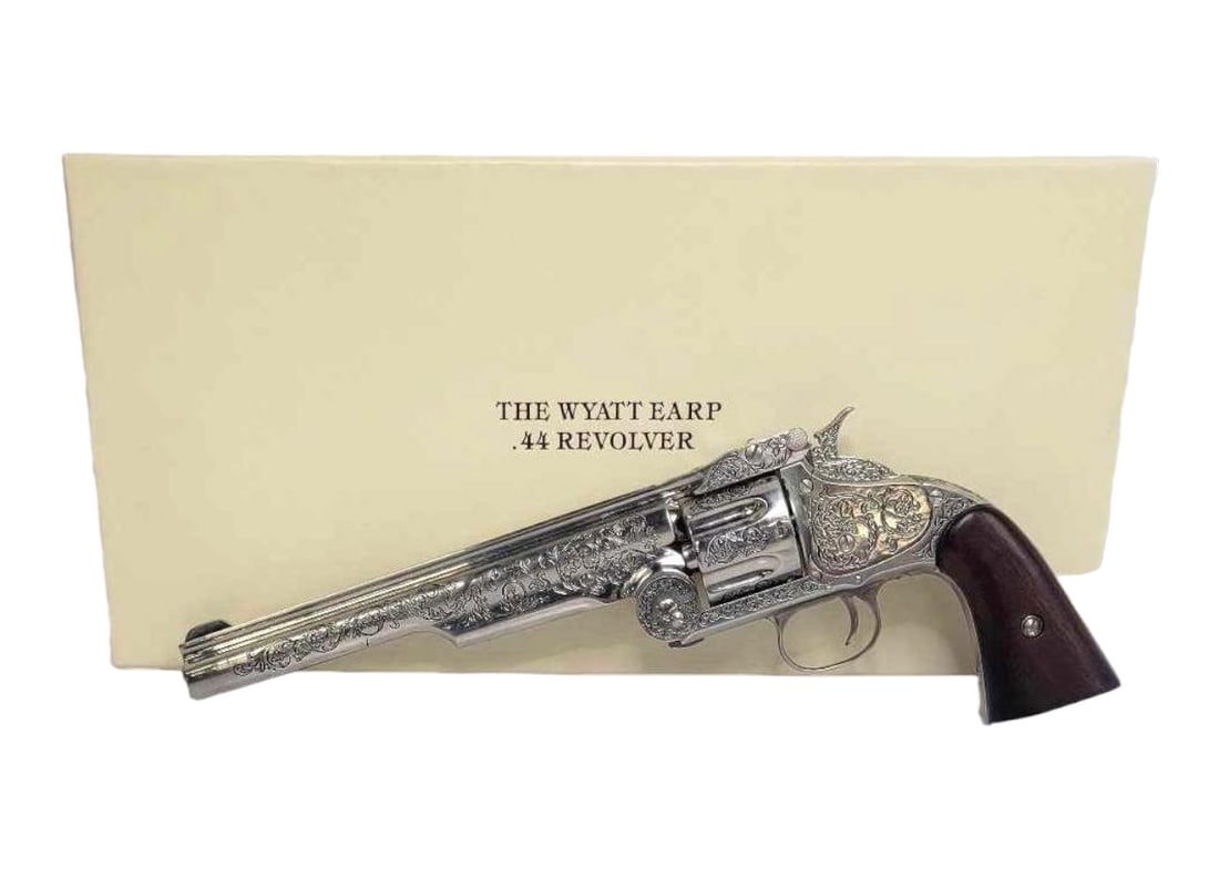 Franklin Mint Wyatt Earp .44 Revolver Reproduction: A reproduction of Wyatt Earp's .44 revolver used at the O.K. Corral gunfight. This non-firing replica example retains the original shipping box, original packaging, all original paperwork, and a f