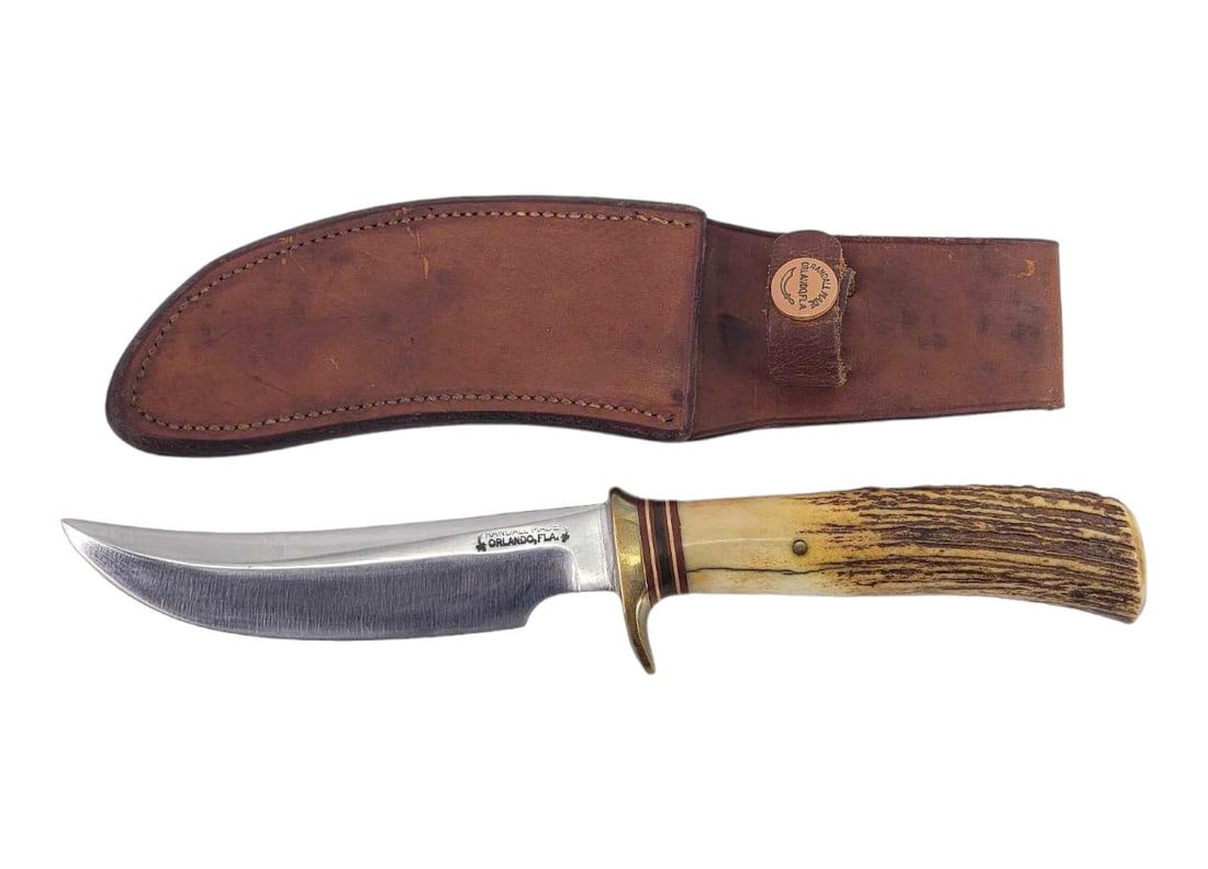 Randall Model 4 Small Game & Skinner Knife w/Sheath: A Small Game and Skinner (model 4) knife designed by Randall Made Knives; marked on left side of blade as shown. Slightly curved blade with brass single hilt, coordinating spacers, and stag handle. Ho