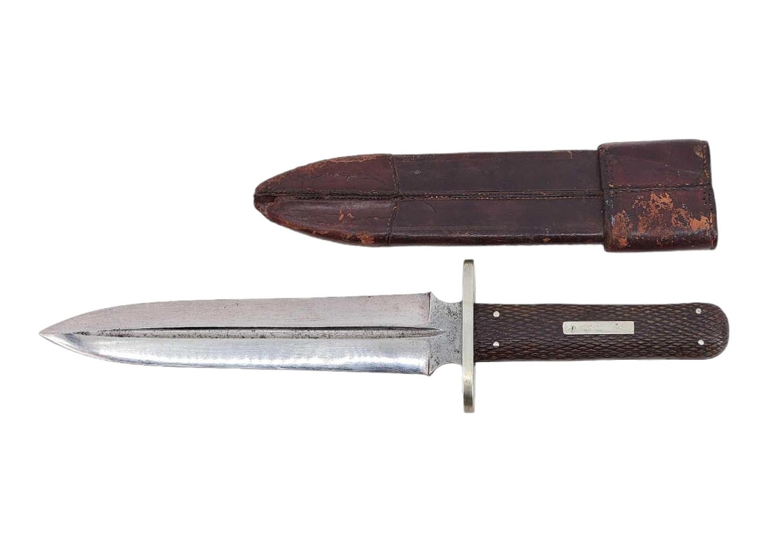 Antique Hunting Dagger w/Sheath: A fixed spear point hunting dagger with full tang, likely Sheffield. Blade is unmarked and has a fuller in the center and two sizable choils on either side and meets a faceted composite handle with fo