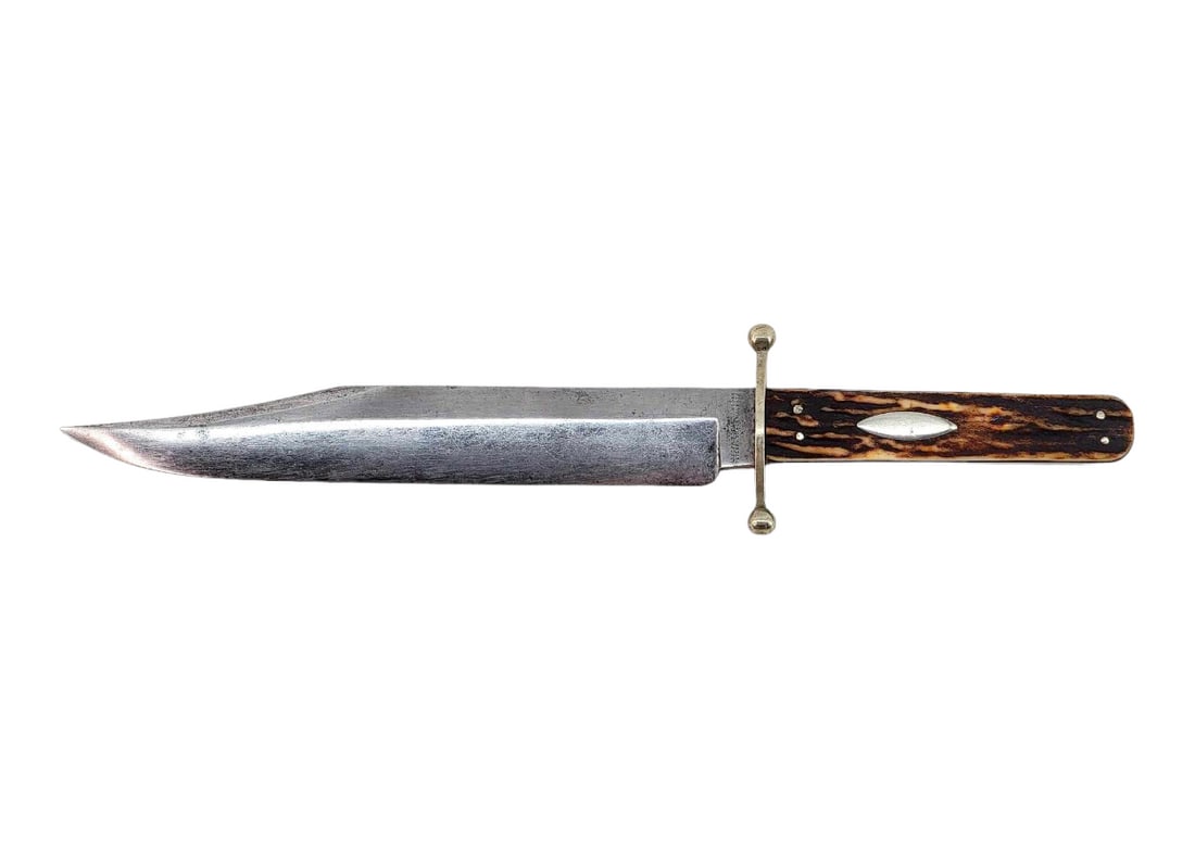Early Joseph Rodgers & Son Sheffield Bowie Knife: A fixed clip blade bowie knife with full tang, c 1861-1901, marked V R Joseph Rodgers & Sons Cutlers to Her Majesty with the Star and Cross trademark on the ricasso. A balled guard leads to a stag