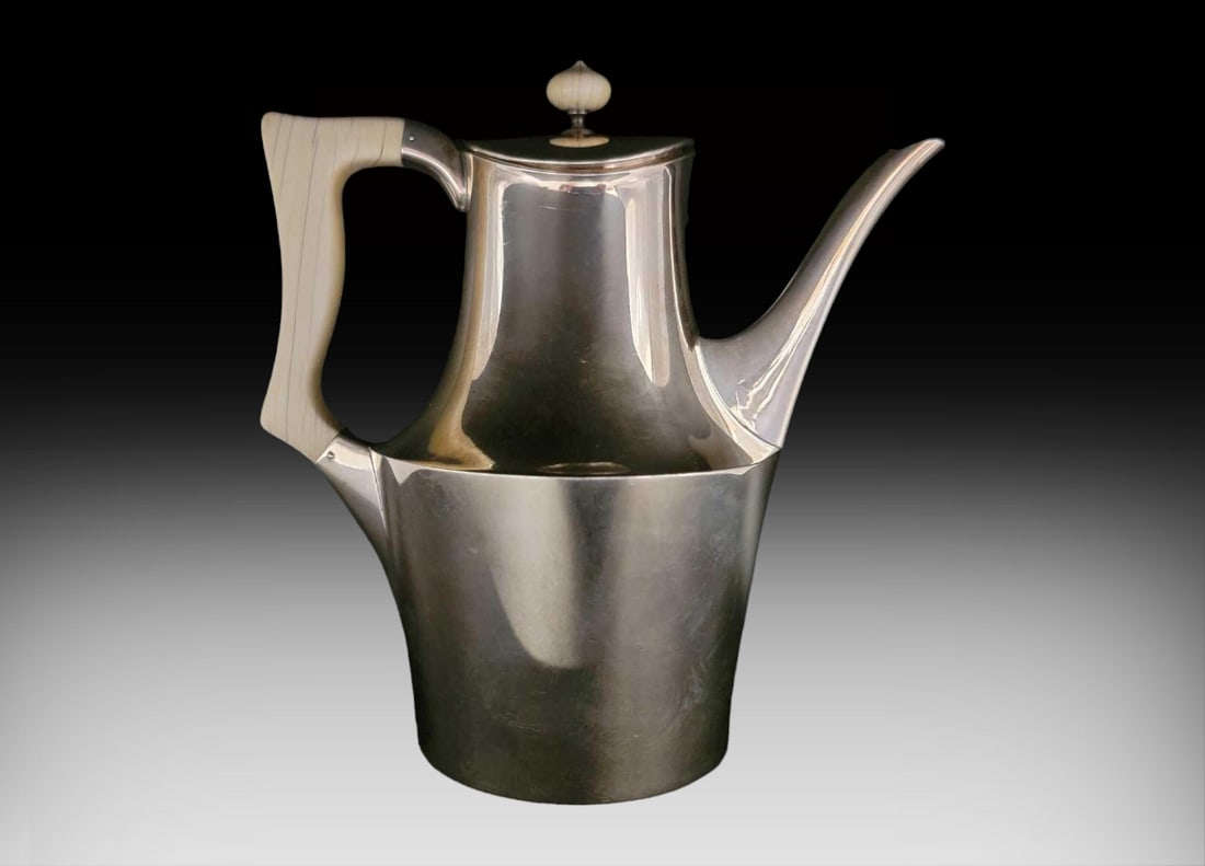 Hans Hansen Danish Sterling Silver Coffee Pot c.1953: A c.1953 Hans Hansen Danish sterling silver coffee pot, characterized by the clear lines and minimalist aesthetics most often seen with the Scandin