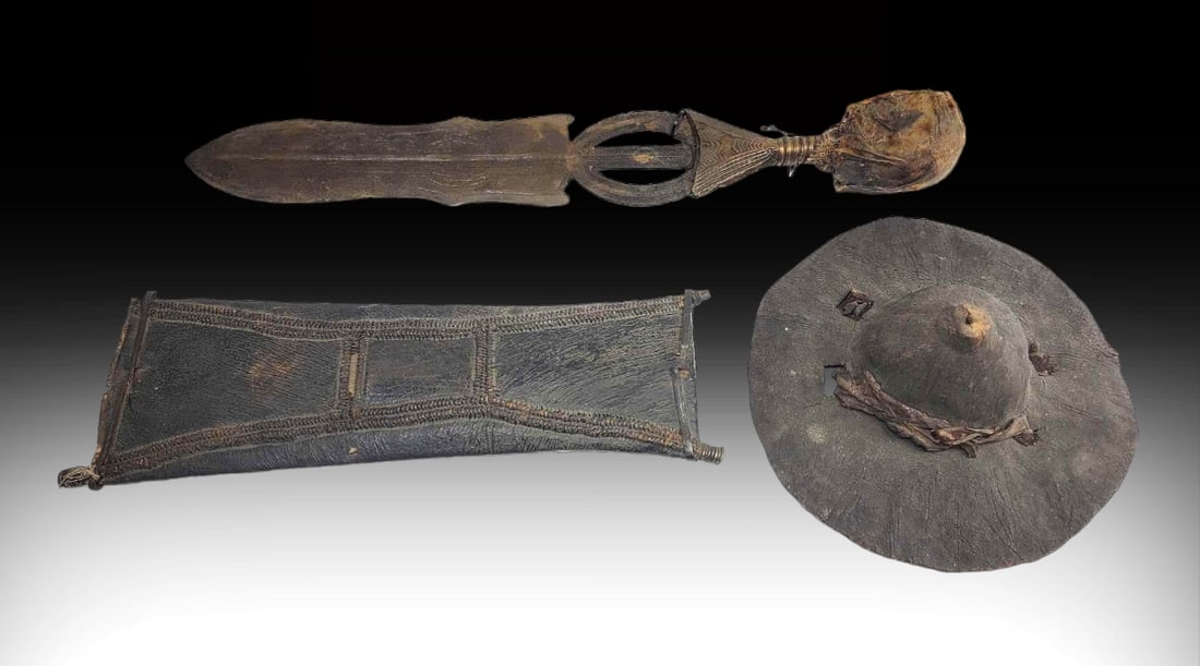 19th Century Sudanese Warrior Dagger & Hide Shield: Two pieces of Sudanese warrior history includes a dagger and a shield, both dating to the late 19th Century during the 1881-1899 Mahdi revolt against the British and the Egyptians; the Upper Nile Suda