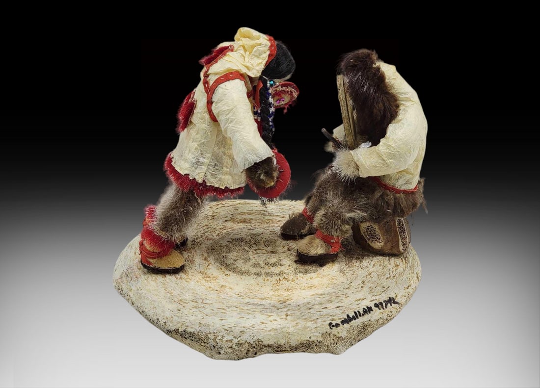 Yup'ik Doll Drummer & Dance Diorama - Beulah Ottillian: A handcrafted story doll diorama by acclaimed Siberian Yup'ik artist Beulah Ottillian of Gambrill, St. Lawrence Island, Alaska. The work depicts an Alaska Native drummer and dancer, both attired i