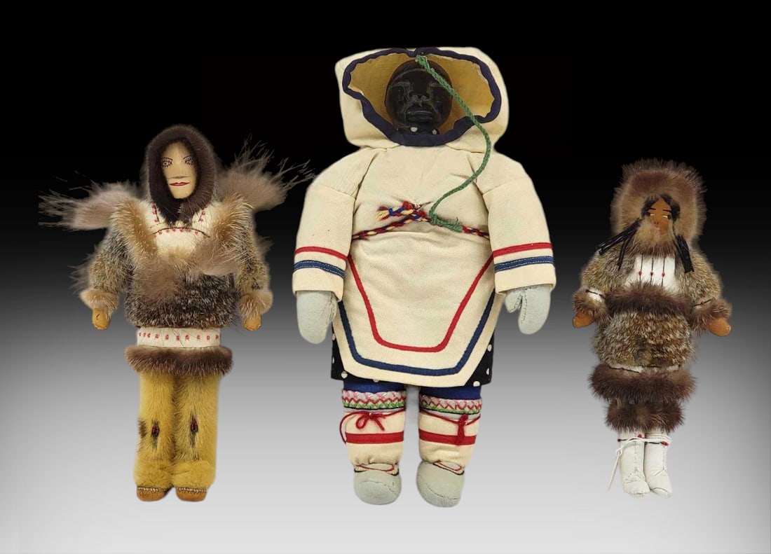 Eskimo & Inuit Dolls: Two handcrafted Alaska Native made dolls plus an Inuit example by three different artists featuring soapstone, wooden, and caribou hide faces, plus traditional apparel crafted from caribou, wolf, and