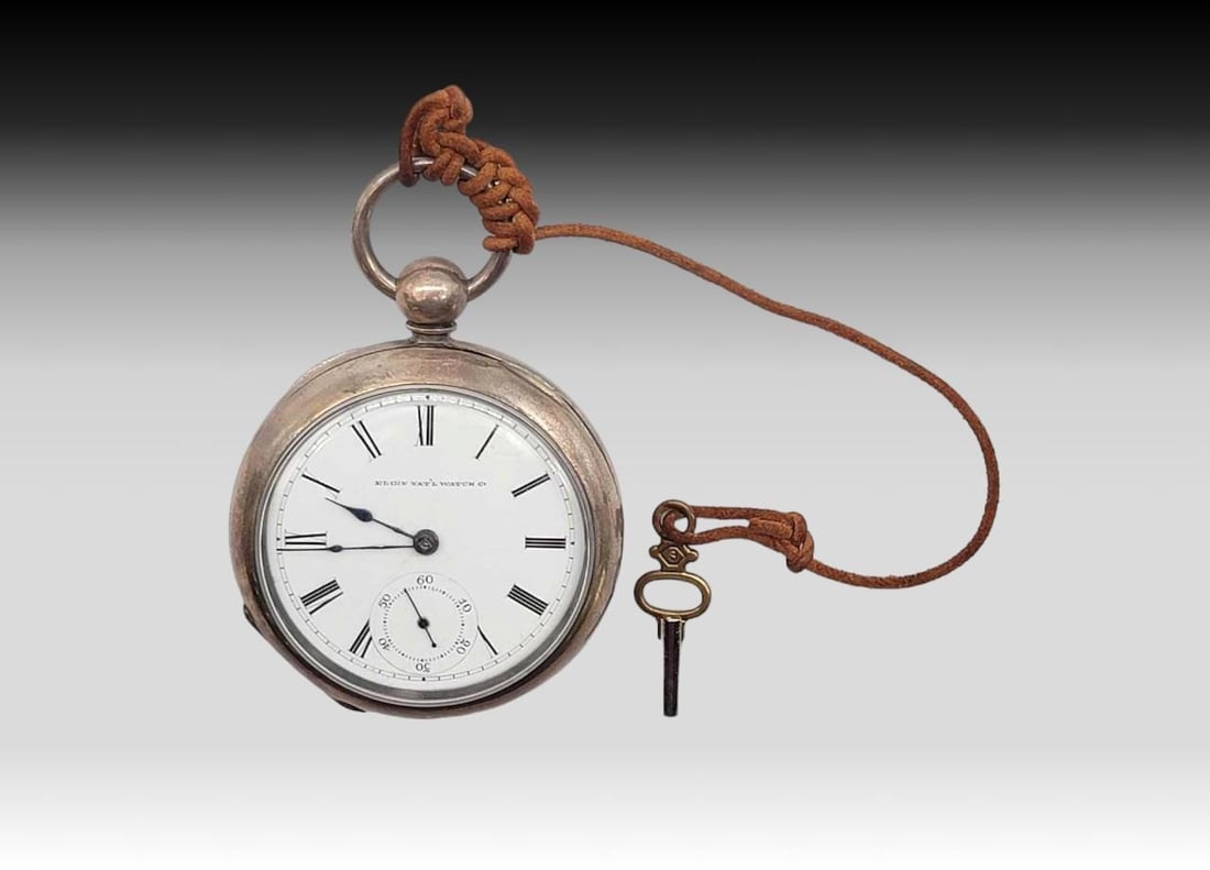 Elgin Model 1 18s Coin Silver Key Wind Pocket Watch c.1878: An antique full double hunter The Chief grade pocket watch with Elgin movement and Elgin Nat'l Watch Co. face with Roman numerals. Case is coin silver with a minimalist engraved design with monogr
