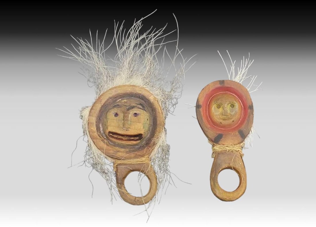 Yup'ik Polychrome Wooden Finger Masks: Two 19th-century or early 20th century Yup'ik polychrome wooden finger/hand masks, each featuring a single finger loop topped by a circular face carved and incised with prominent noses, eyes, eyeb