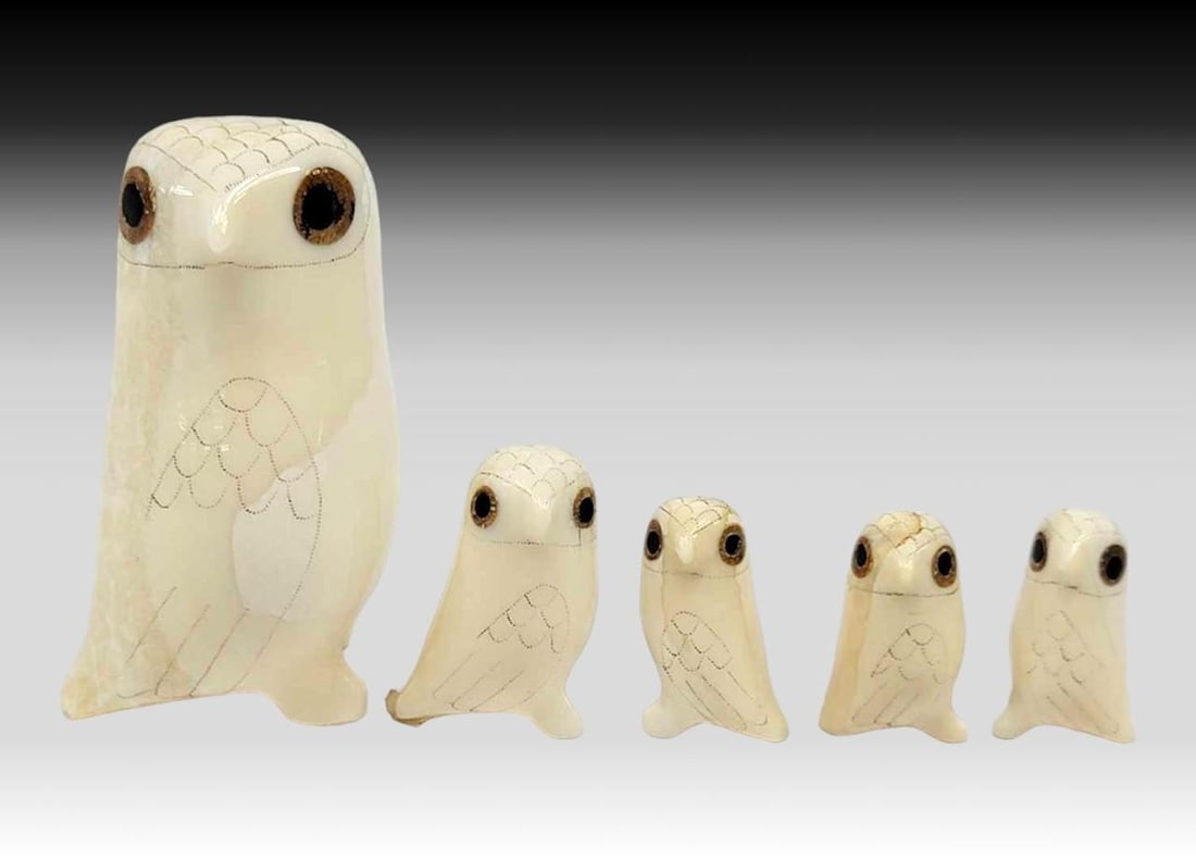 Walrus Tusk & Baleen Scrimshaw Owls: A parliament of five owls in three sizes, all carved from walrus tusk and featuring inset baleen eyes and light scrimshaw details. The largest measures approximately 1.25" x 1" x 2" tall.