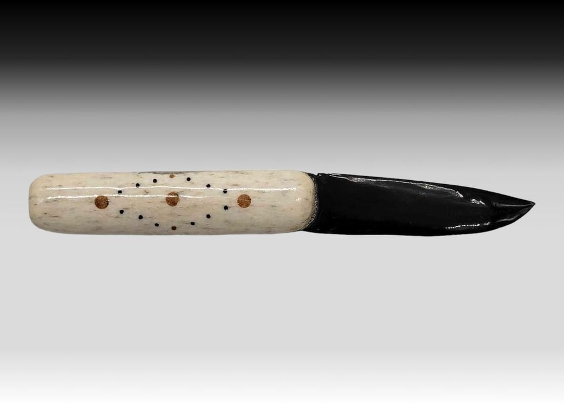 Walrus Tusk Letter Opener w/ Baleen Blade & Fossilized Tusk Accents: A letter opener crafted from a rich black baleen blade and a walrus tusk handle, inset with dots of fossilized walrus tusk and baleen in a diamond pattern. Letter opener measures approximately 1" 