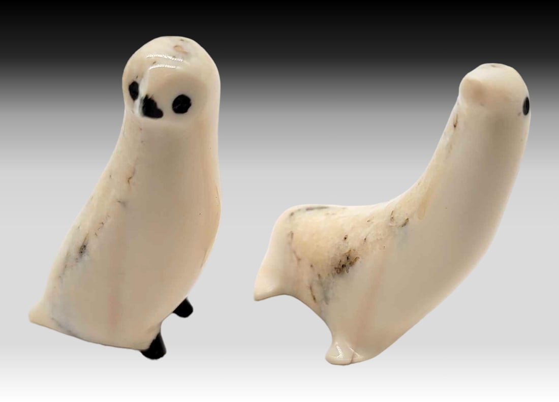 Walrus Tusk & Baleen Owl & Seal Figurines: A cute set of wildlife carved from walrus tusk and accented with baleen includes an owl and a seal. The largest measures approximately 1.75" x 1" x 2" tall.