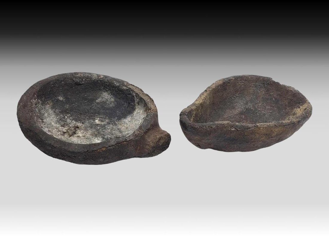 Prehistoric Qulliq (Seal Oil Lamps) - Clay & Walrus Tusk: Two prehistoric qulliq, or oil lamps, includes one crafted from clay and excavated from the permafrost by Central Siberian Yup'ik artist Ladd Soonagrook of Gambell, St. Lawrence Island, Alaska; th