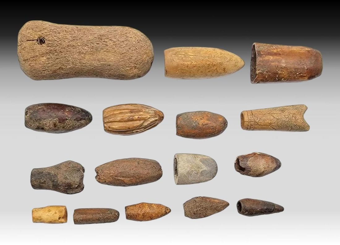 Thule & Earlier Bird Blunts and Point Covers: Sixteen assorted bird blunts and spear/arrow point covers ranging from the Thule culture to the 19th century, in varied designs and sizes. The largest measures approximately 3" x 1.5" x 1"