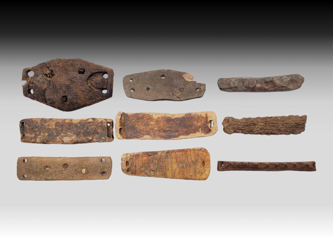 Thule & Earlier Ice Cleats: A group of nine cleats, attached to the bottom of boots to limit slippage on ice, crafted from ancient walrus tusk and bone, Thule culture to the 19th century. The largest measures approximately 2.5&#