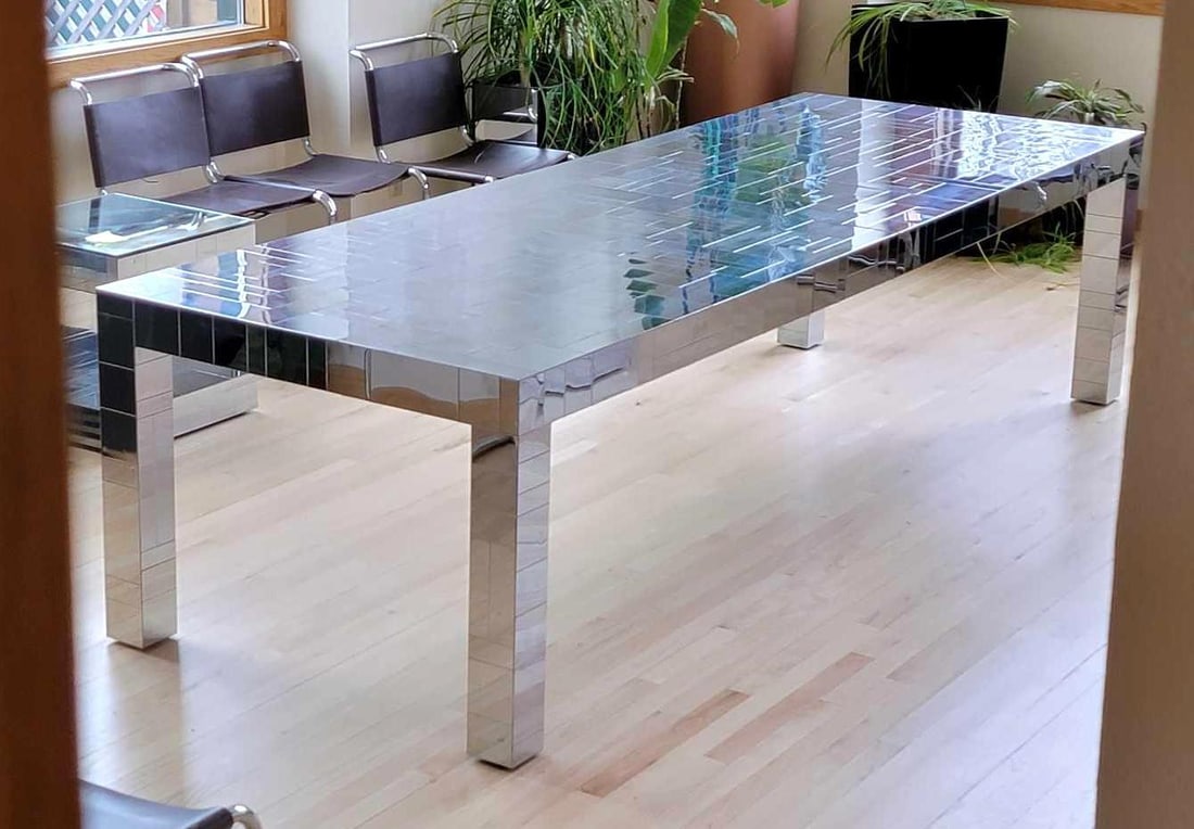 9.5' Paul Evans Cityscape Tessellated Chrome-Plated Steel Dining Table w/ Leaves: A 9.5 foot long tessellated chrome-plated steel Cityscape dining table featuring a quartet of square corner legs and dual leaves. Designed and signed by studio art furniture maker Paul Evans (American