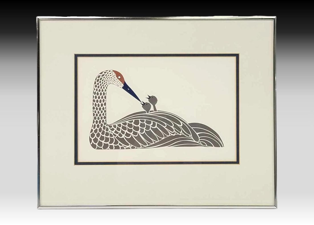Rie Muñoz "Crane with Young" Lithograph: A lithograph entitled "Crane with Young" by Alaska artist Rie Muñoz (1921-2015). The work, original issued c.1978, depicts a beautiful crane in gray with blue and orange accents, tending to h