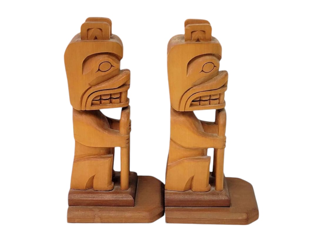 Tlingit Cedar Beaver Totemic Bookends - Steve Perrin: A pair of hand-carved Tlingit cedar bookends in the form of traditional totem poles featuring the likeness of beavers. Each is mounted on a small wooden base with waterfall edge, and further mounted u