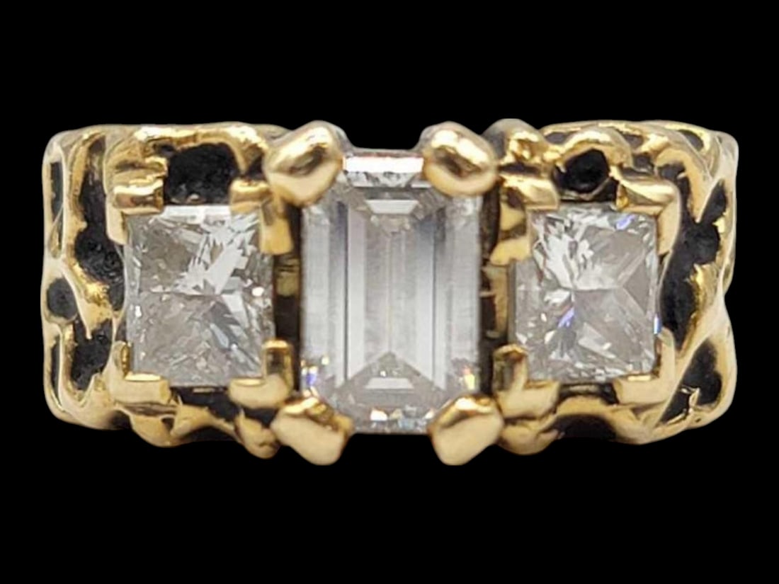 1.88 ctw Diamond Ring in 14k Yellow Gold: A ladies contemporary size 5 diamond ring in 14 karat yellow gold with a single 0.94 carat emerald cut diamond measuring 7.30 x 4.50 x 2.75mm, flanked by a pair of 0.47 carat prong set princess cut di