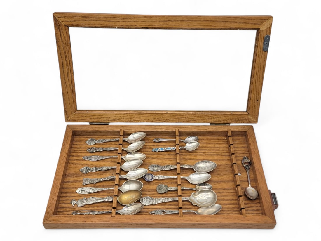 Sterling Silver Alaska-Themed Commemorative Spoons: Fifteen commemorative sterling silver spoons includes two marked simply for Alaska, one for the Alaska-Yukon-Pacific Exposition, one for the Seal of the Territory of Alaska, and one depicting a team o