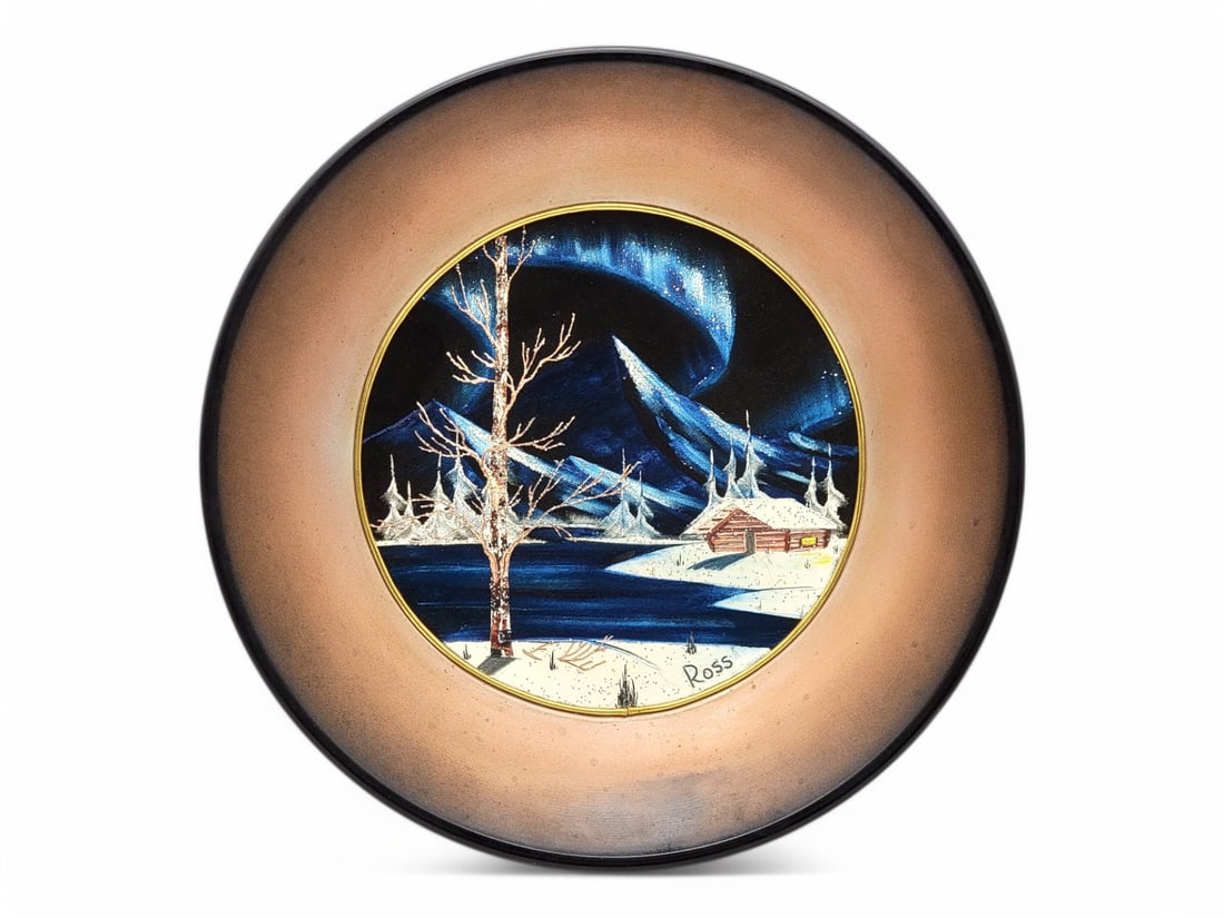 Bob Ross Alaskan Gold Pan Painting c.1971: An original Bob Ross oil painting on velvet on a novelty gold mining pan, created early in his career as shown by the date of 1971 en verso. Ross was born in Daytona Beach, Florida, in 1942 and was st