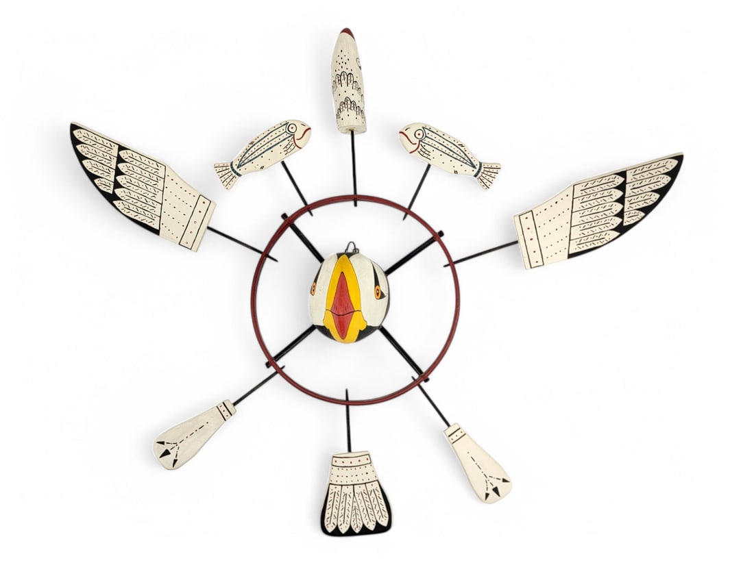 Nunivak Yup'ik Bald Eagle Spirit Wheel - Nick Shavings: A Nunivak Island carved and polychrome painted spirit wheel by the Yup'ik artist Nick R. Shavings (b.1950). This colorful example features a central polychrome horned puffin, the outer bentwood rings 