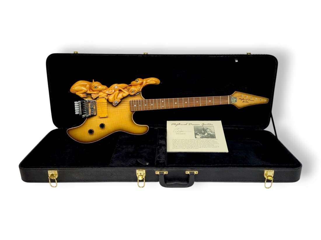 Eric Larson Haida-Designed Electric Mythical Dream Guitar: A one-of-a-kind electric "Mythical Dream" guitar by artist Eric Larson, dated c.2007. The piece features a Pacific Northwest Coast Haida-style body depicting assorted carved animals with abalone shell