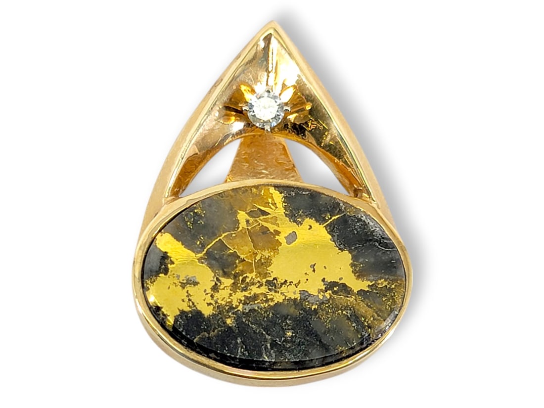 Black Gold Quartz Pendant in 14k Yellow Gold w/Diamond: A pierced teardrop-shaped pendant in 14 karat yellow gold featuring an oval cabochon of polished gold quartz (natural gold as found in the quartz.) Above the gold quartz cabochon rests a prong-set 3.5