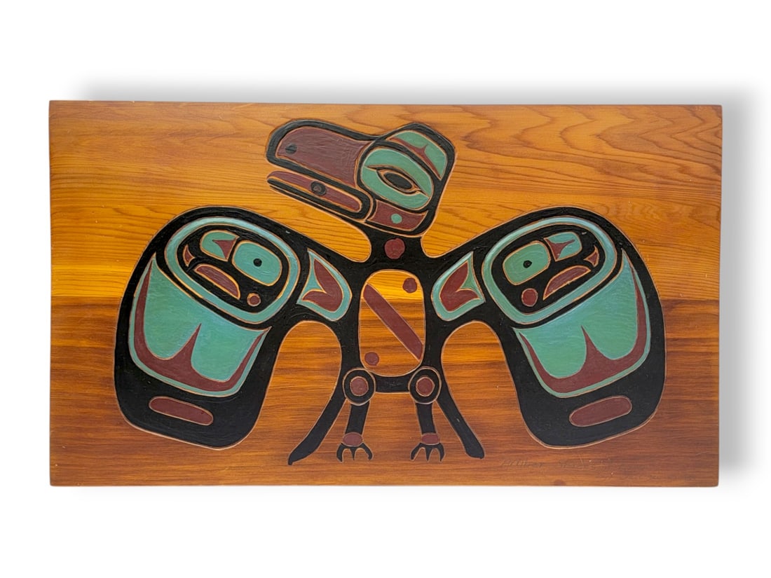 Northwest Coast Red Cedar "Amber Shades of Raven" Formline Painting - Shut'gie: A Northwest Coast carved and painted red cedar panel depicting the raven, a central figure in the Haida and Tlingit indigenous cultures of the Pacific Northwest. In this example titled "Amber Shades o