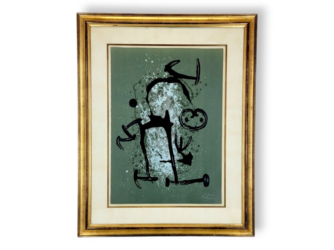 Joan Miro "L'Illettre Vert (The Illiterate - Green)" Lithograph: A signed and numbered 5/75 abstract lithograph by Joan Miro (Spain, 1893-1983). Titled "L'Illettre Vert (The Illiterate - Green)", the image depicts a dark figure upon a green background dotted with w