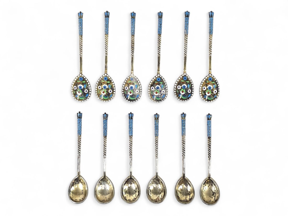 Antique Russian Silver & Enamel Demitasse Spoons: A matched set of one dozen Russian silver demitasse spoons featuring intricate cloisonné enamel floral motifs in blue, green, white, and red on the reverse of each bowl. The handles are twisted silve