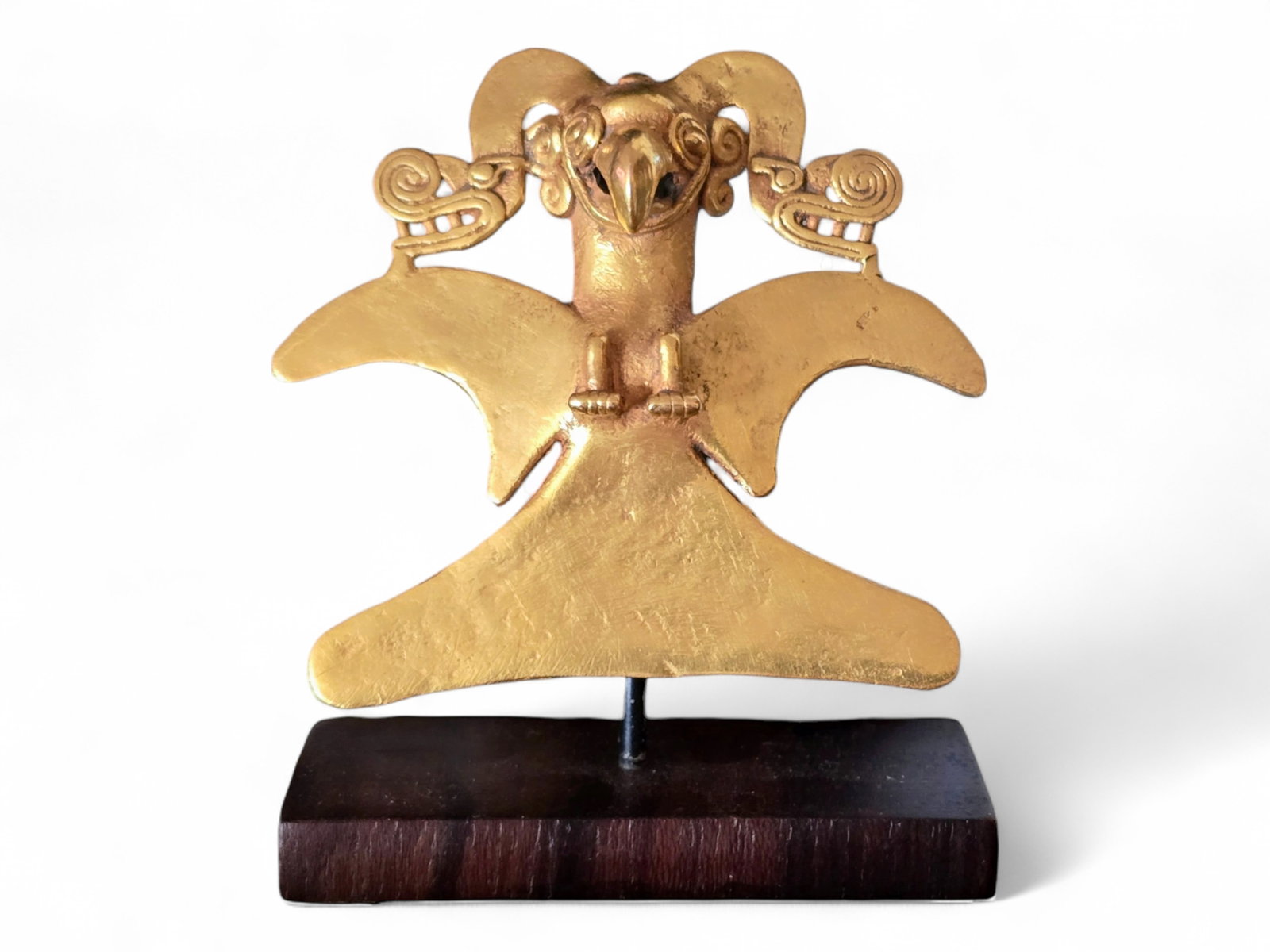 A Pre-Columbian Gold Avian Pendant - Costa Rica 700-1550 AD: A pre-Columbian solid gold avian pendant from Costa Rica, dating to the Diquís period, circa 700–1550 AD. This finely cast ornament exemplifies the sophisticated metalworking traditions of the anci