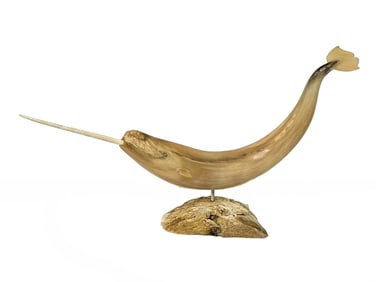 An Inuit Muskox Horn Carved Narwhal - Nick Sikkuark